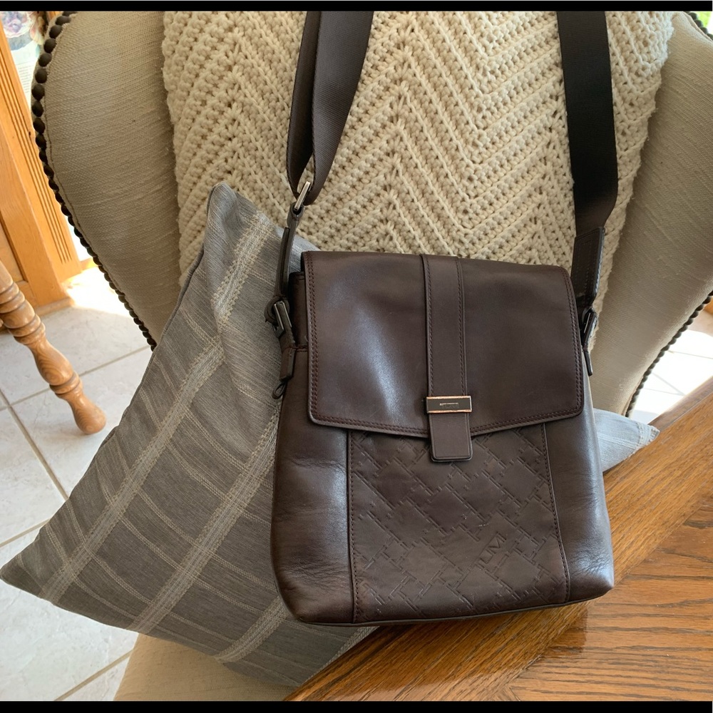 Tumi  leather  brown crossbody webbed strap 9x10"